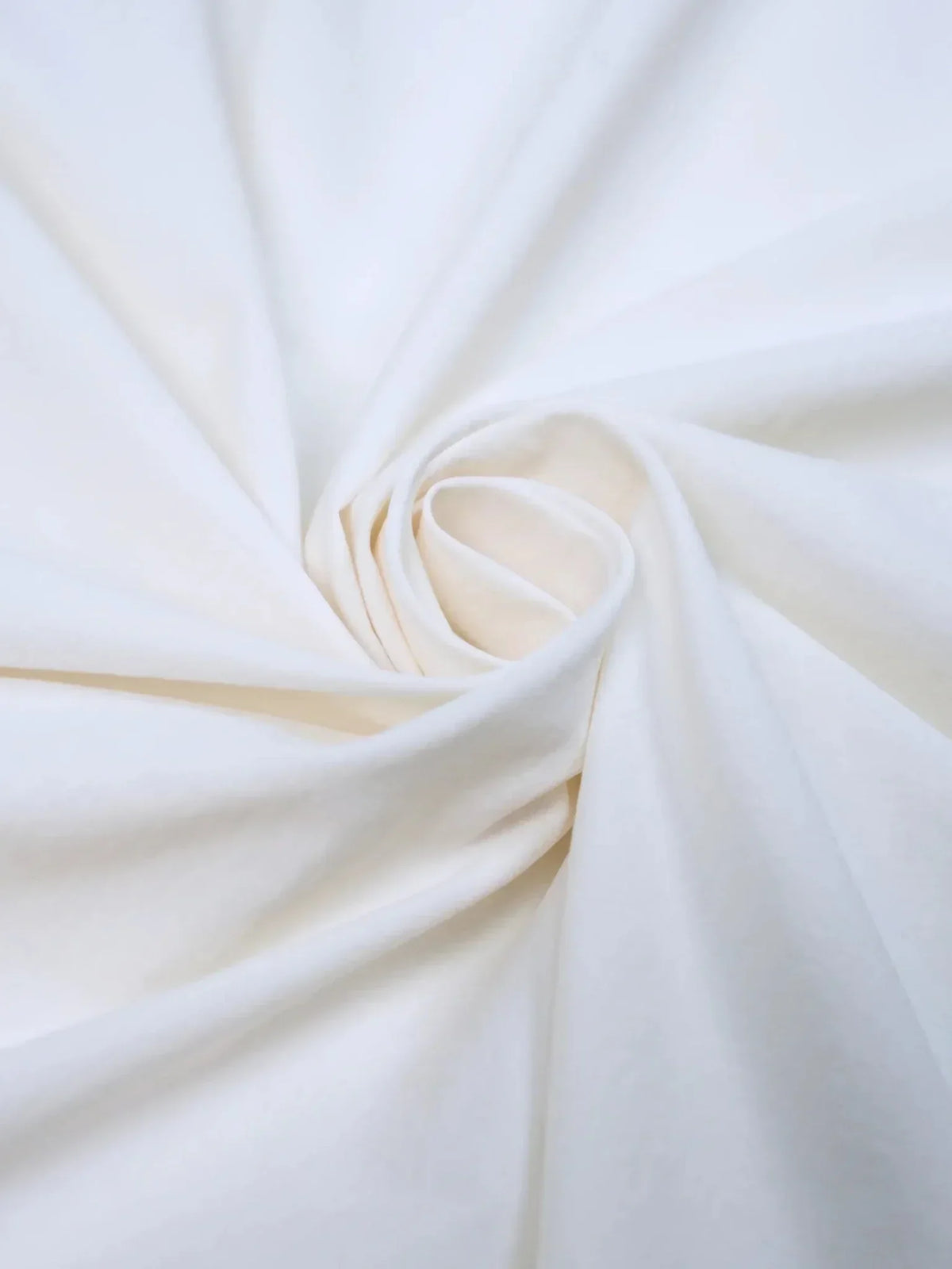 Soft white draped fabric texture for a PUFFLT sleeveless bubble dress.